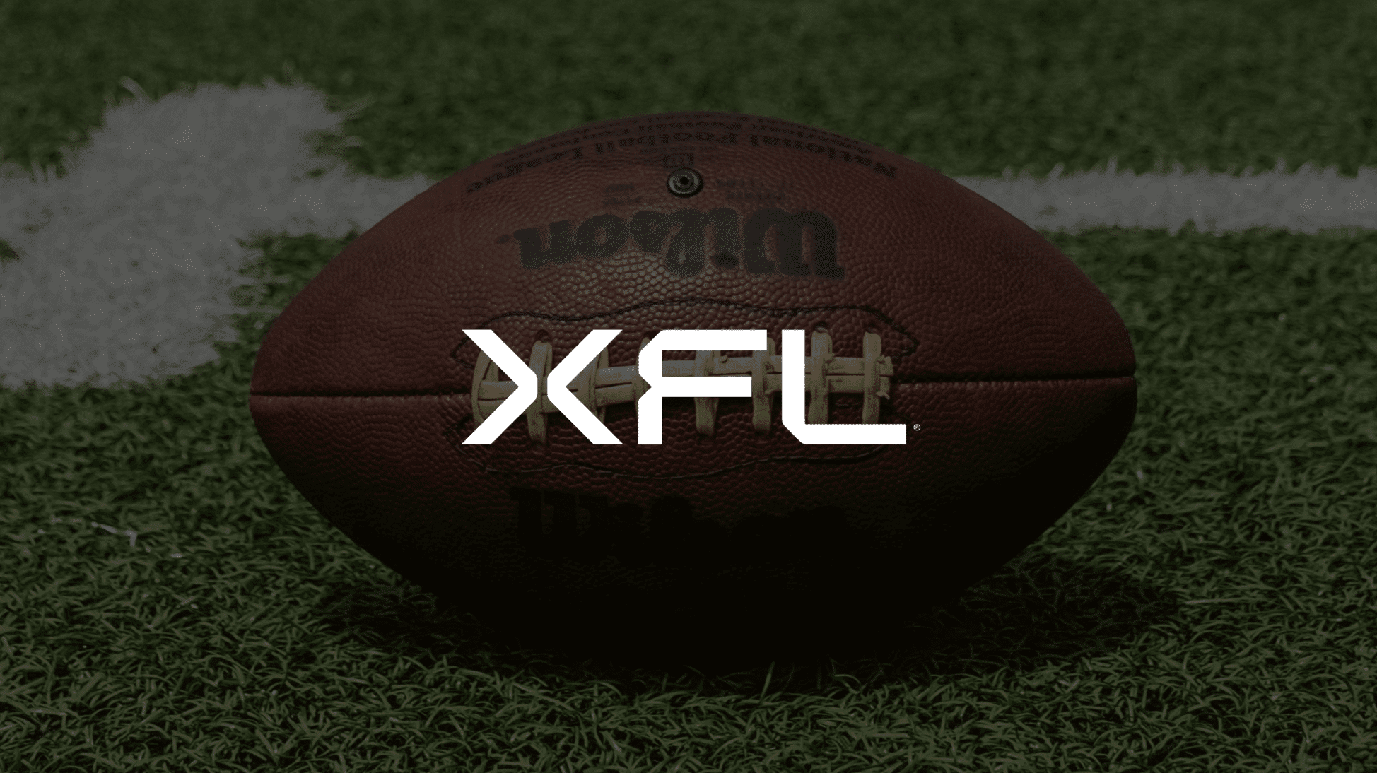 xcl logo over football on football field