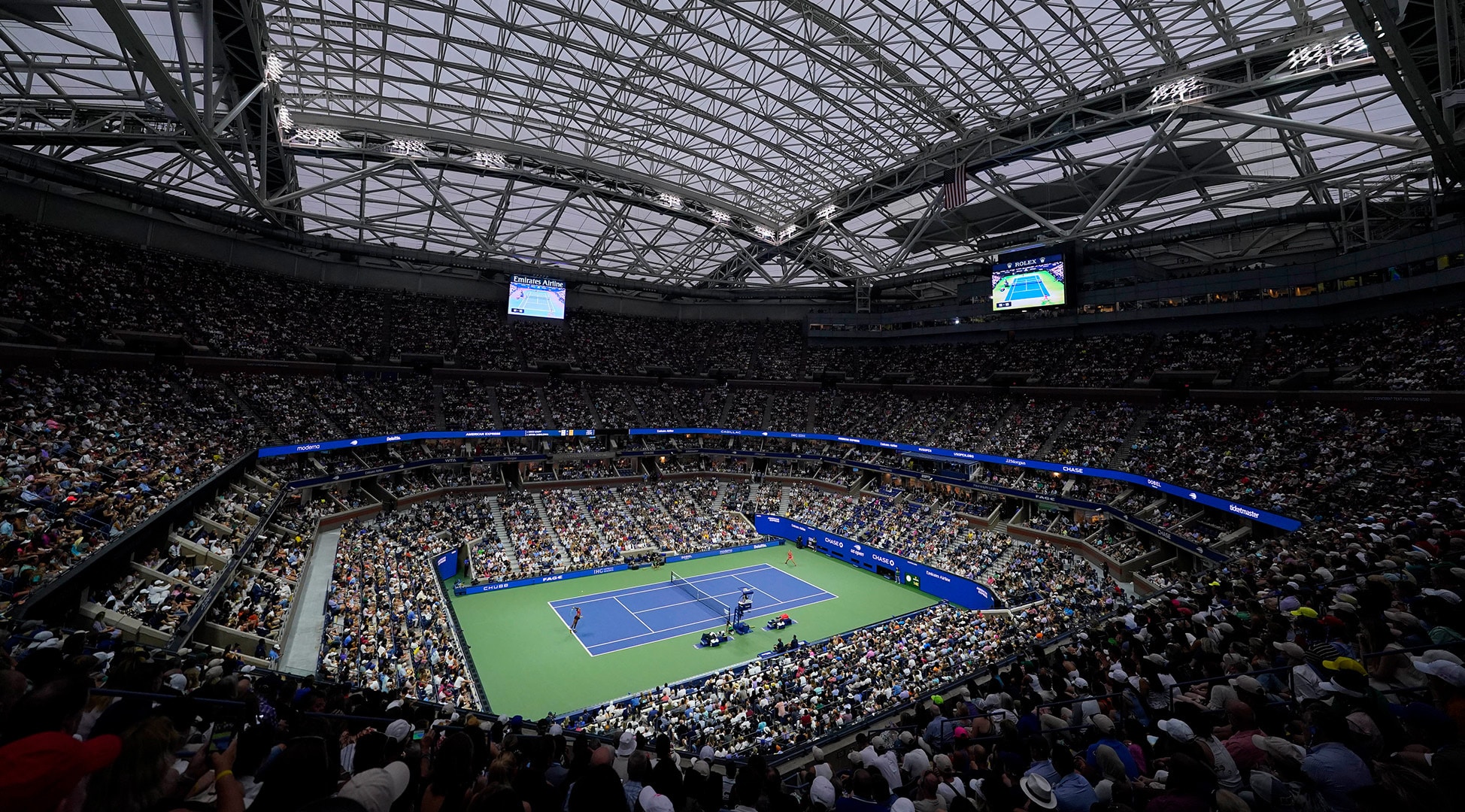 Tennis stadium filled with fans.