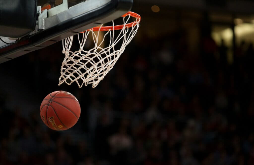 basketball swooshing through hoop