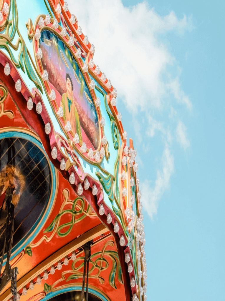 Colorful circus ride with open sky behind it