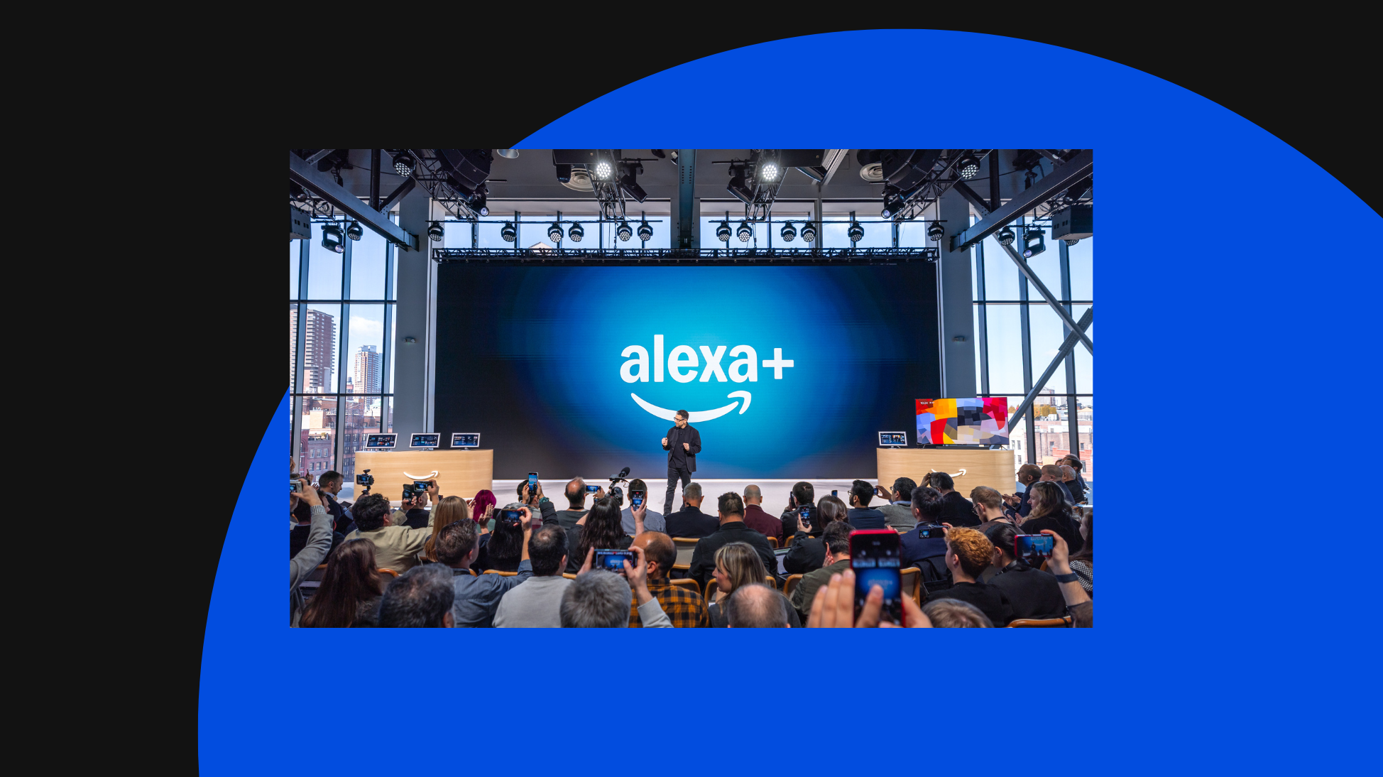 speaker on stage, in front of a crowd announcing the new Alexa+ release