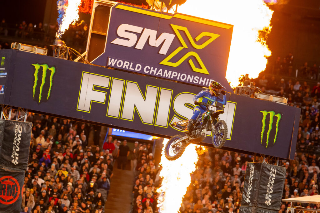 Image of a motorbike flying between flames at the SMX World Championships.