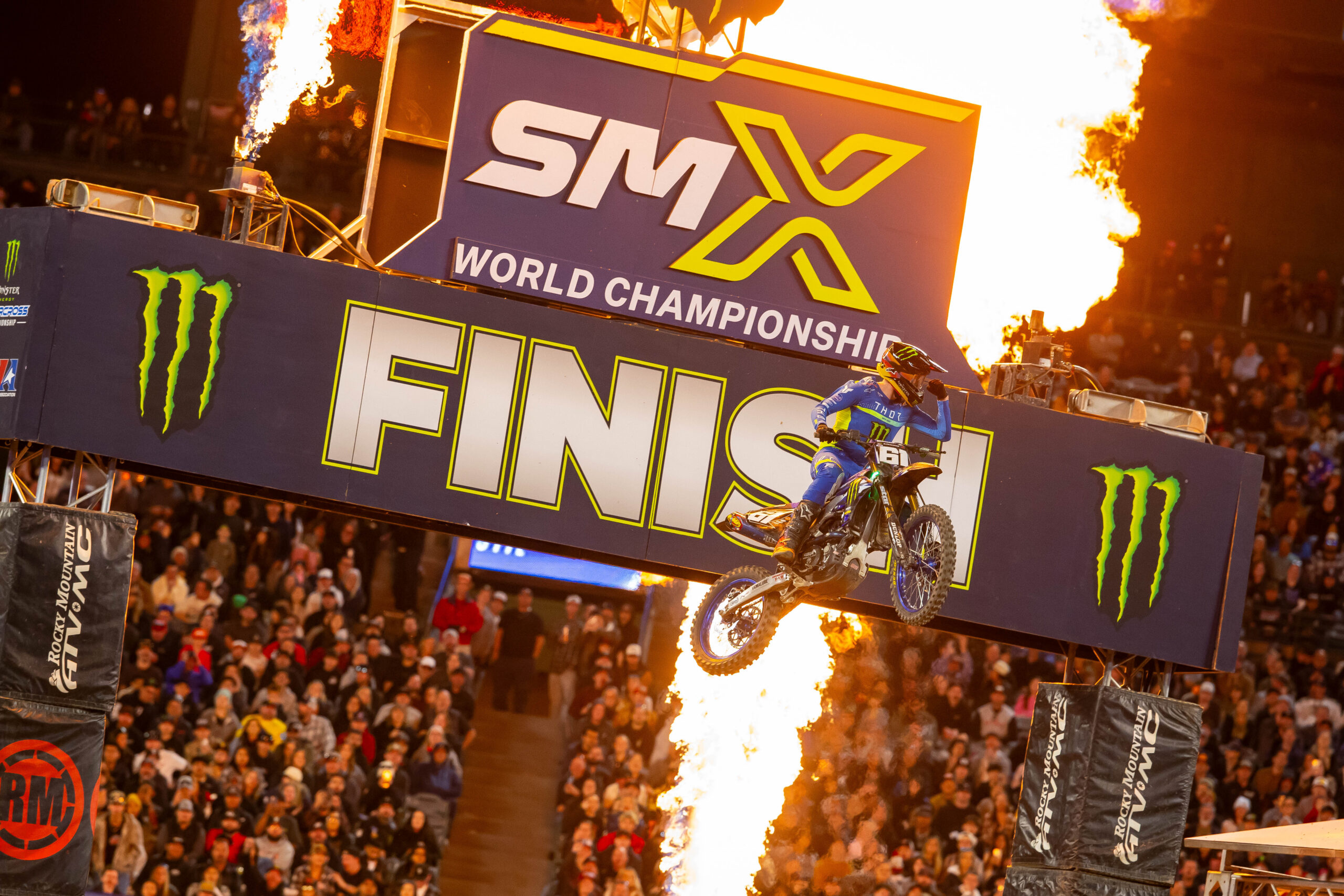 Image of a motorbike flying between flames at the SMX World Championships.