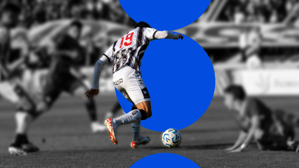 Image of soccer player kicking the ball during a game.