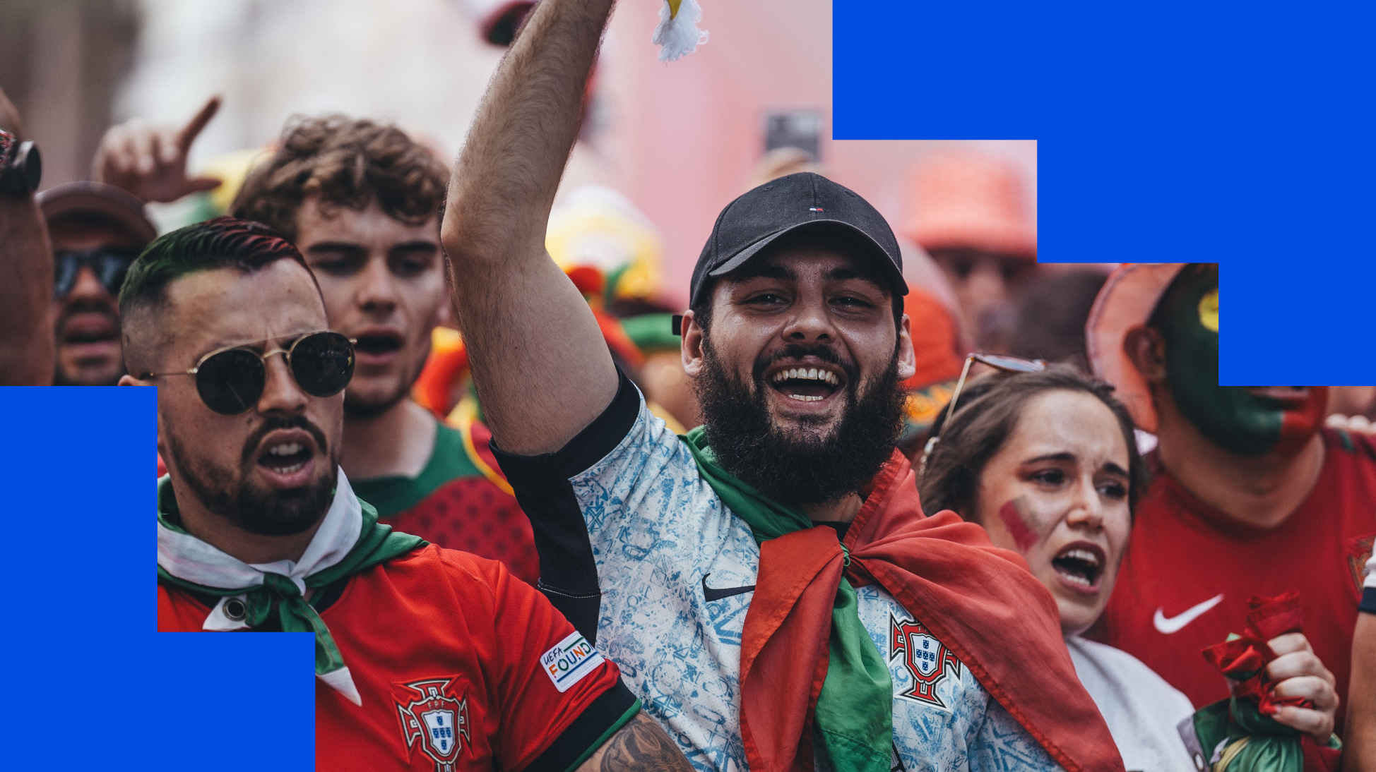 An image of a group of soccer fans cheering