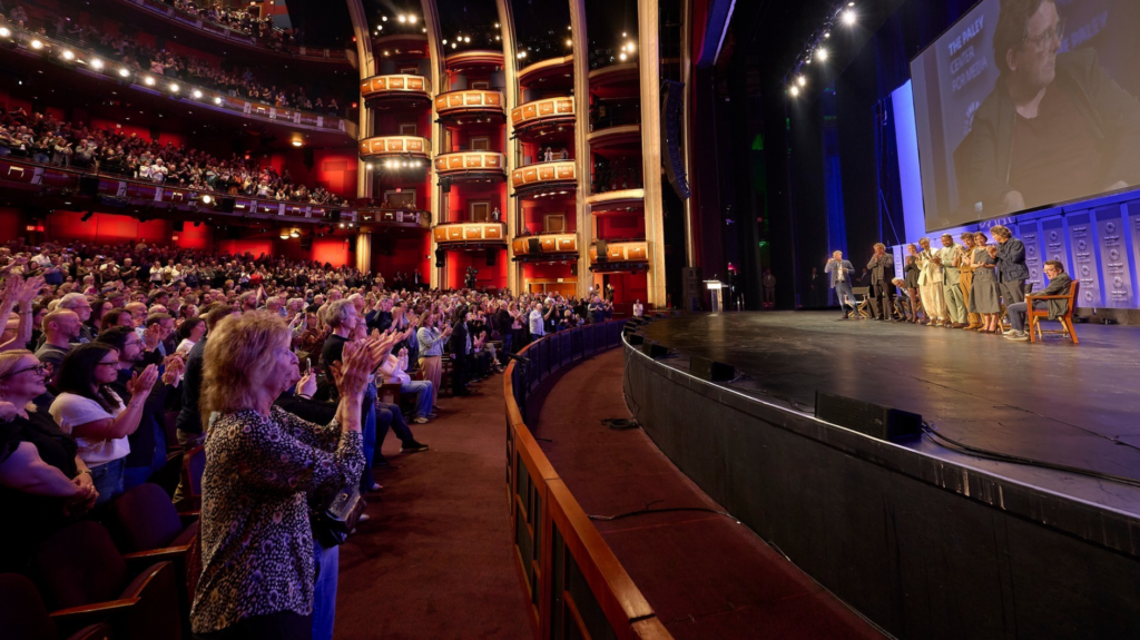 An image of the crowd at Paleyfest, giving a standing ovation to the speakers panel.