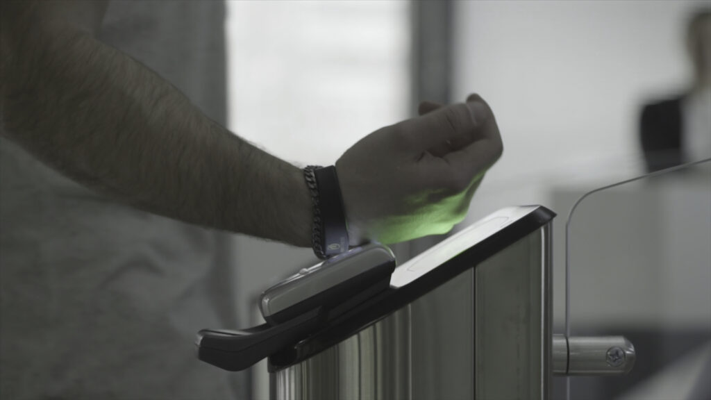 Image of an RFID wristband being scanned.