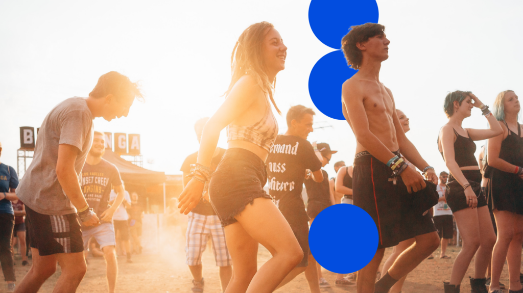 Image of music festival fans in a field.