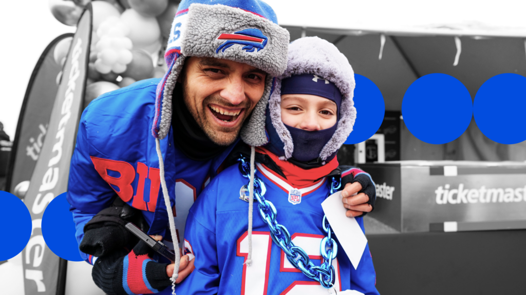 Image of a man and a boy smiling at a Buffalo Bills game