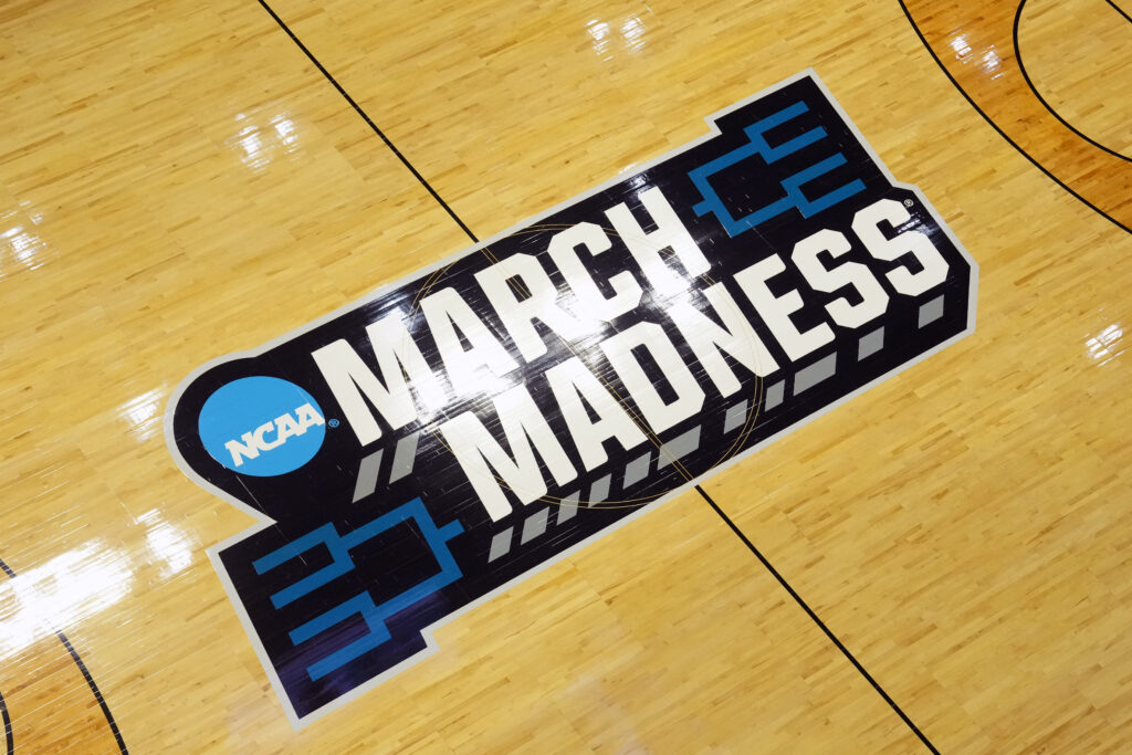 Image of the March Madness logo across a basketball court.